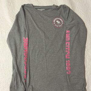Abercrombie and Fitch grey long-sleeve with pink glitter.
